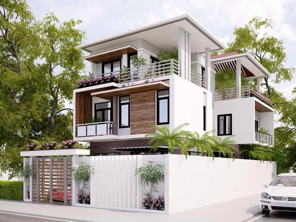 Hình ảnh phối cảnh mẫu nhà phố 3 tầng nằm ở góc đường, nổi bật với hàng rào trắng bao quanh