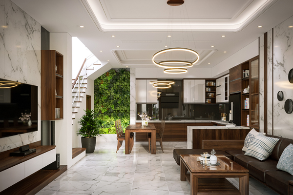H&igrave;nh ảnh to&agrave;n cảnh ph&ograve;ng kh&aacute;ch với tường ốp đ&aacute; cẩm thạch sang trọng, b&agrave;n ghế gỗ, kệ tivi đối diện, cạnh đ&oacute; l&agrave; ph&ograve;ng bếp ăn