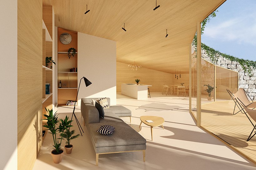 H&igrave;nh ảnh ph&ograve;ng kh&aacute;ch với sofa x&aacute;m, tường v&agrave; trần ốp gỗ m&agrave;u s&aacute;ng, liền kề đ&oacute; l&agrave; bếp ăn tiện nghi