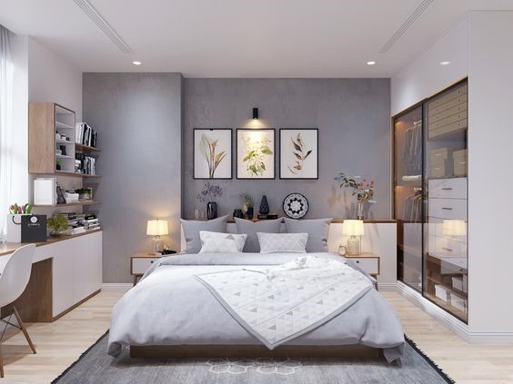 hình ảnh phòng ngủ master phong cách hiện đại với tranh trang trí đầu giường, bàn học liền giá sách
