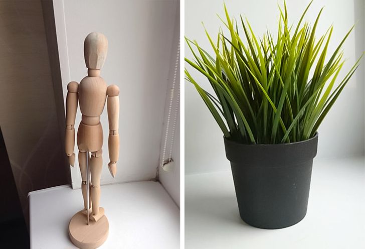 h&igrave;nh ảnh cận cảnh bức tượng gỗ nhỏ v&agrave; chậu c&acirc;y nhựa