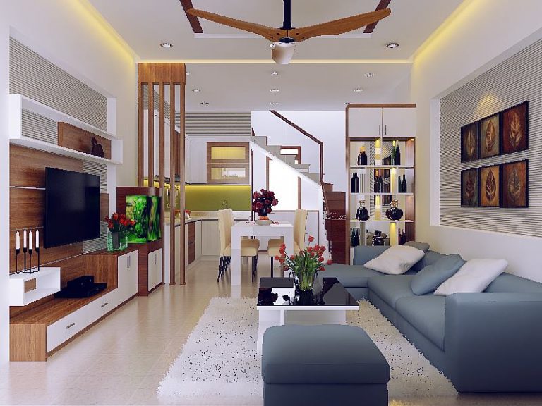 h&igrave;nh ảnh ph&ograve;ng kh&aacute;ch nh&agrave; ống 3 tầng được thiết kế theo phong c&aacute;ch hiện đại với điểm nhấn l&agrave; bộ ghế sofa m&agrave;u xanh x&aacute;m trẻ trung, thanh lịch.