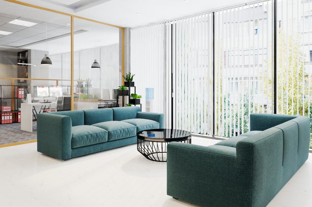 h&igrave;nh ảnh sảnh tầng 3 văn ph&ograve;ng đẹp ở H&agrave; Nội với ghế sofa lớn m&agrave;u xanh dương, b&agrave;n tr&agrave; tr&ograve;n bề mặt m&agrave;u đen b&oacute;ng