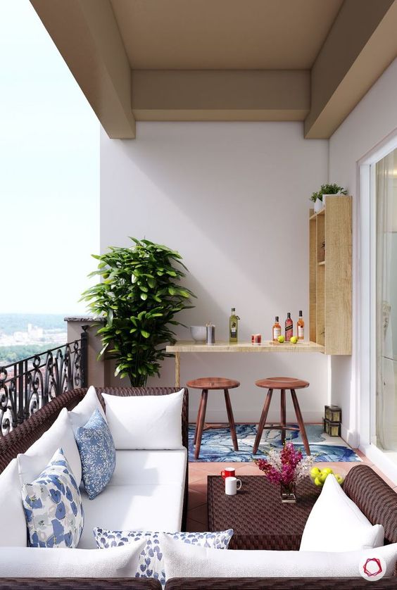 G&oacute;c ban c&ocirc;ng nhỏ ấn tượng với đồ nội thất bằng liễu gai tối m&agrave;u, một quầy bar mini đủ chỗ cho hai người c&ugrave;ng l&uacute;c.