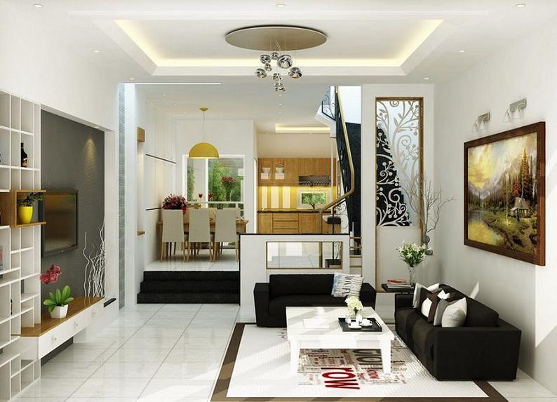 Ph&ograve;ng kh&aacute;ch hiện đại, b&agrave;i tr&iacute; tối giản với điểm nhấn l&agrave; bộ ghế sofa m&agrave;u đen, b&agrave;n tr&agrave; vu&ocirc;ng m&agrave;u trắng tương phản v&agrave; tủ kệ tivi ki&ecirc;m chức năng trang tr&iacute; ở ph&iacute;a đối diện