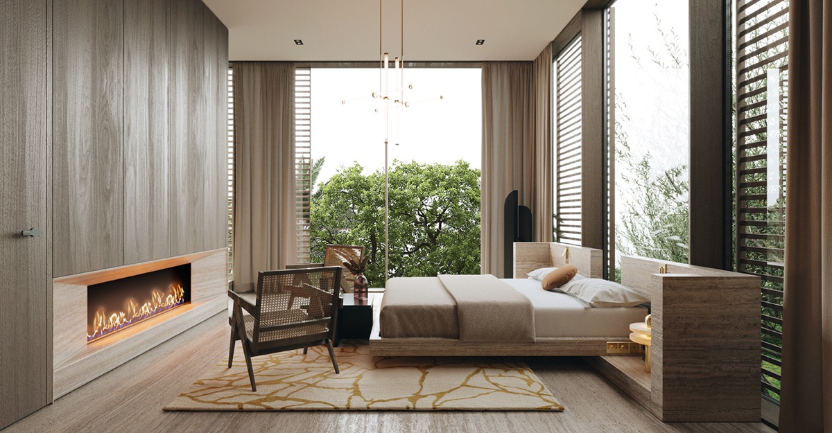 L&ograve; sưởi rộng lấp đầy phần c&ograve;n lại của bức tường, l&agrave;m ấm khu vực tiếp kh&aacute;ch trong ph&ograve;ng ngủ master trong biệt thự hiện đại.