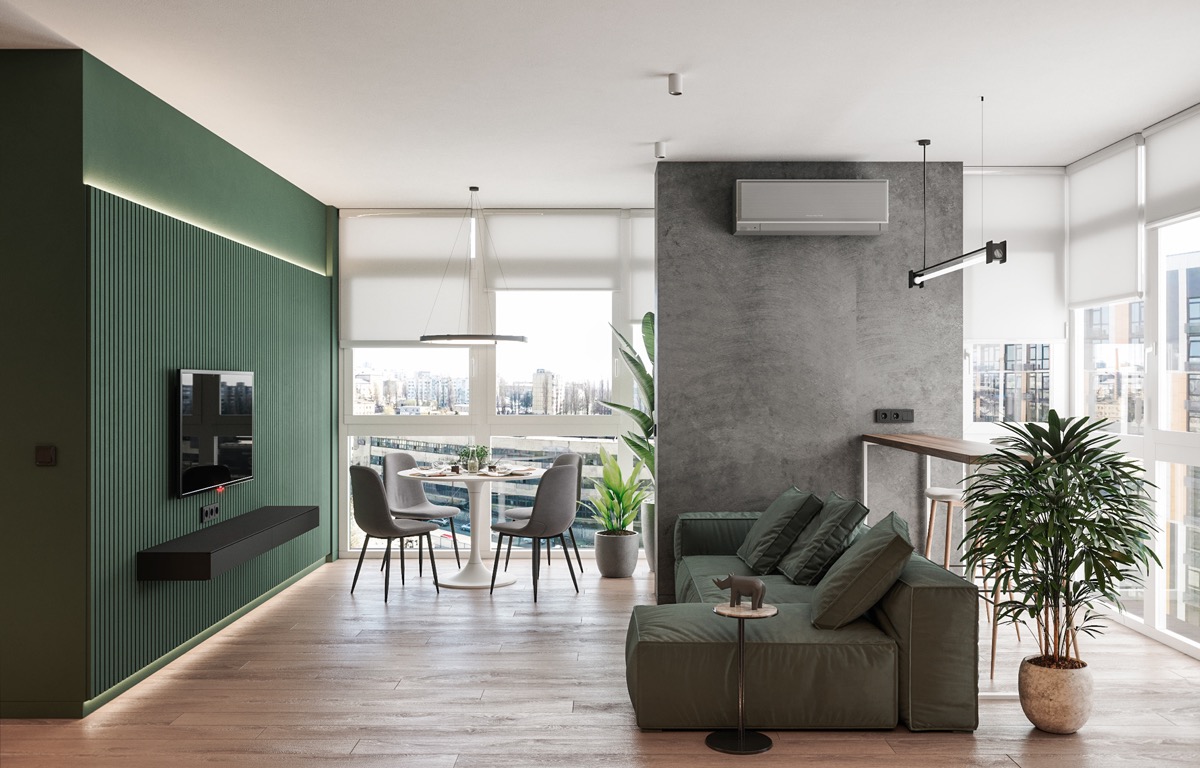 phòng khách liên thông phòng ăn trong căn hộ 90m2 với ghế sofa, tường tivi sơn màu xanh lá