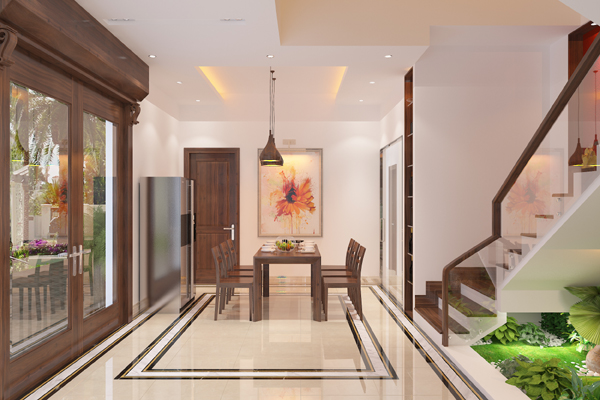 Ph&ograve;ng ăn rộng r&atilde;i, ấm c&uacute;ng với bộ b&agrave;n ghế b&agrave;n ghế gỗ truyền thống. Tranh treo tạo điểm nhấn nghệ thuật, xua tan vẻ đơn điệu của sơn tường m&agrave;u trắng.