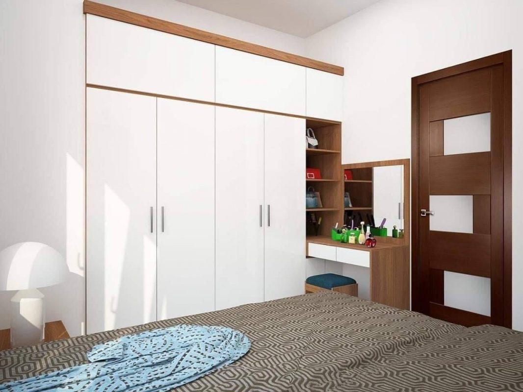 Trong ph&ograve;ng ngủ, bề mặt c&aacute;nh tủ quần &aacute;o được l&agrave;m chất liệu Acrylic b&oacute;ng gương để tạo hiệu ứng kh&ocirc;ng gian như tho&aacute;ng rộng hơn về mặt thị gi&aacute;c.