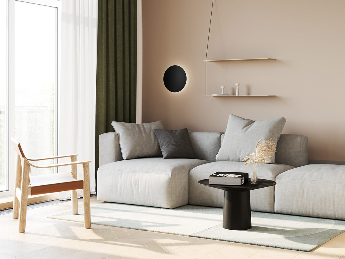 Sơn tường m&agrave;u n&acirc;u tạo n&ecirc;n sự đồng điệu nhẹ nh&agrave;ng cho chiếc ghế sofa m&agrave;u x&aacute;m mềm mại trong ph&ograve;ng kh&aacute;ch căn hộ 79m2. Kệ mở mỏng mảnh tạo điểm nhấn tinh tế.