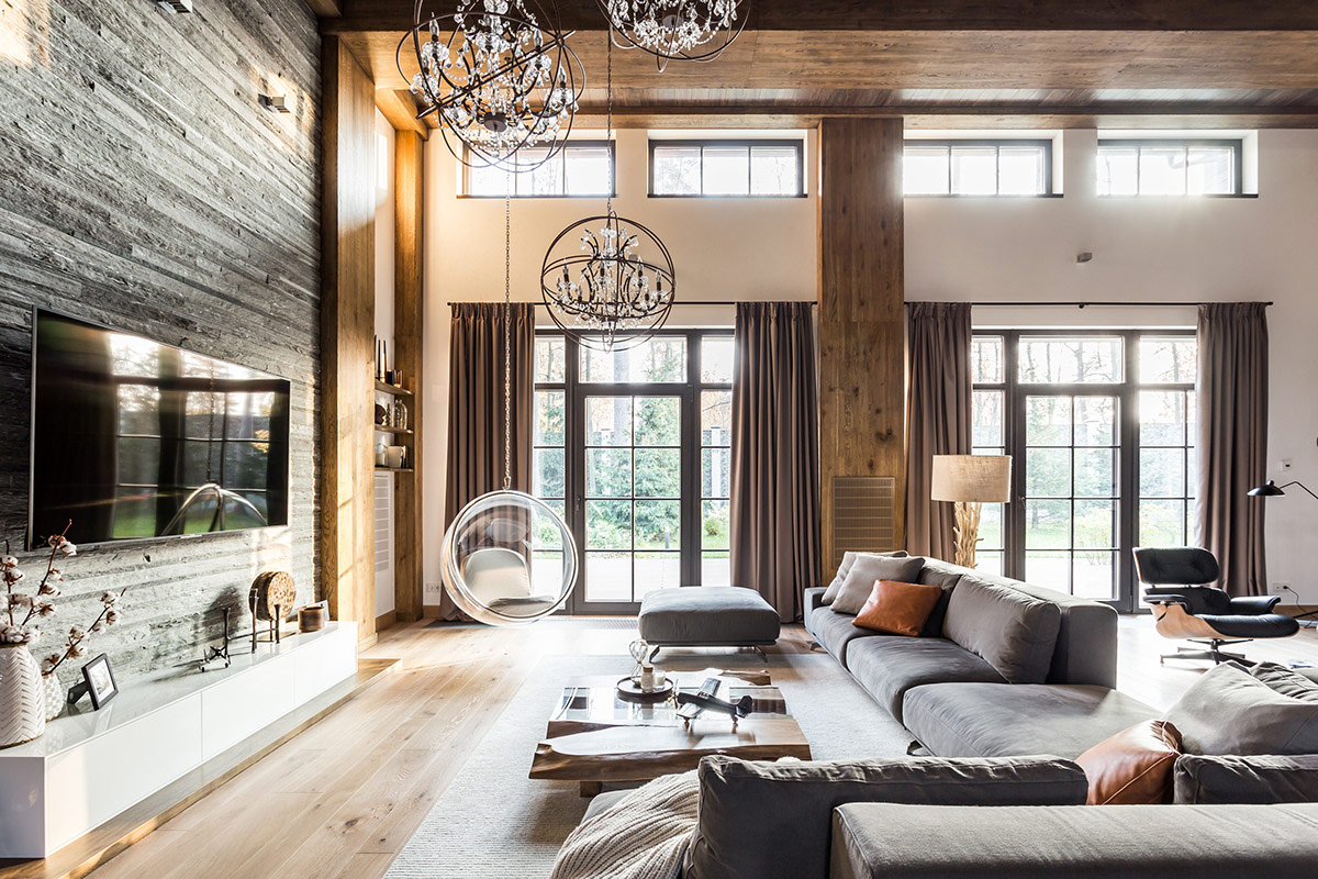 Ph&ograve;ng kh&aacute;ch ng&ocirc;i nh&agrave; phong c&aacute;ch Rustic được bao bọc trong t&ocirc;ng m&agrave;u gỗ ấm &aacute;p, th&acirc;n thiện.