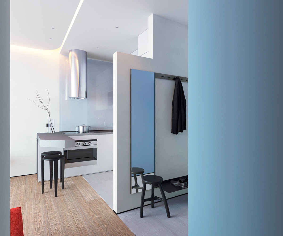 Thiết kế b&agrave;n đảo bếp ăn nhập v&agrave;o khu vực tiếp kh&aacute;ch, trong khi lối v&agrave;o được tận dụng để bố tr&iacute; tủ lưu trữ, kệ gi&agrave;y d&eacute;p v&agrave; gương lớn gắn tường.