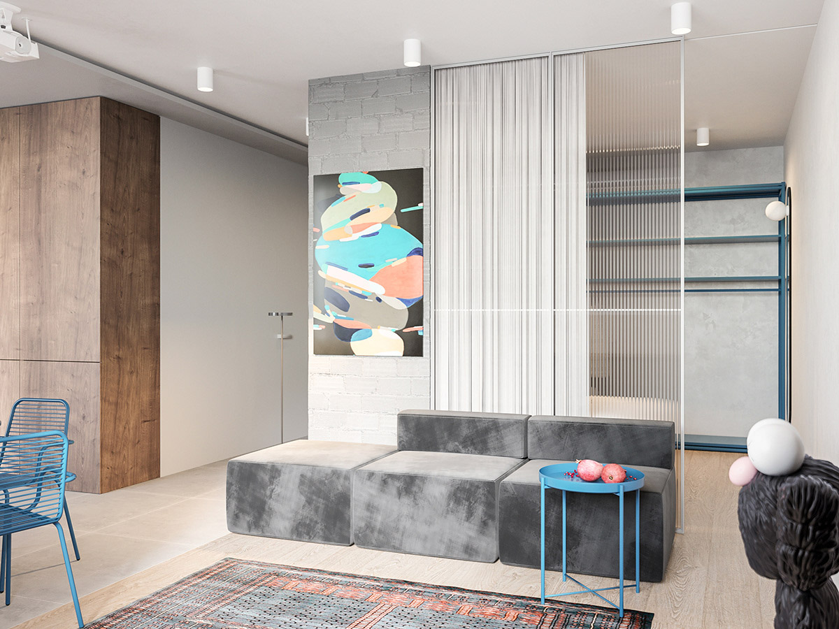 ph&ograve;ng kh&aacute;ch căn hộ nhỏ với sofa x&aacute;m, b&agrave;n tr&agrave; phụ m&agrave;u xanh dương