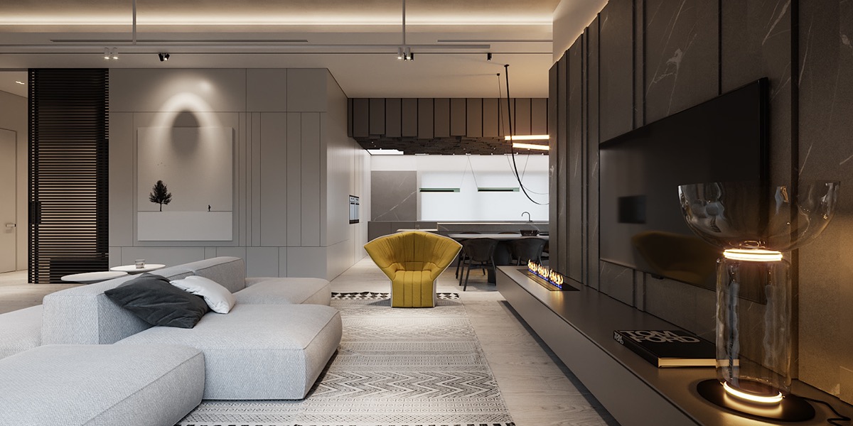 ph&ograve;ng kh&aacute;ch với bộ sofa m&agrave;u x&aacute;m lớn, ghế b&agrave;nh m&agrave;u v&agrave;ng nổi bật
