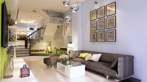 ph&ograve;ng kh&aacute;ch nh&agrave; l&ocirc; 3 tầng với ghế sofa da m&agrave;u đen, bộ tranh tường độc đ&aacute;o, ph&iacute;a trong l&agrave; cầu thang, khu bếp kết hợp ph&ograve;ng ăn