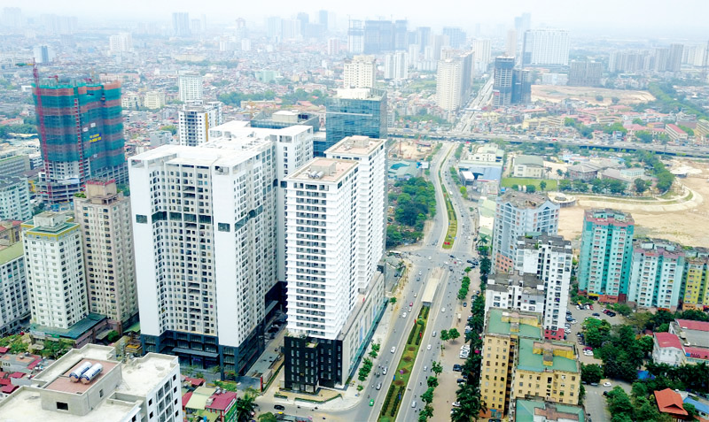 h&igrave;nh ảnh một g&oacute;c th&agrave;nh phố nh&igrave;n từ tr&ecirc;n cao với c&aacute;c t&ograve;a nh&agrave; cao tầng xen kẽ khu d&acirc;n cư thấp tầng