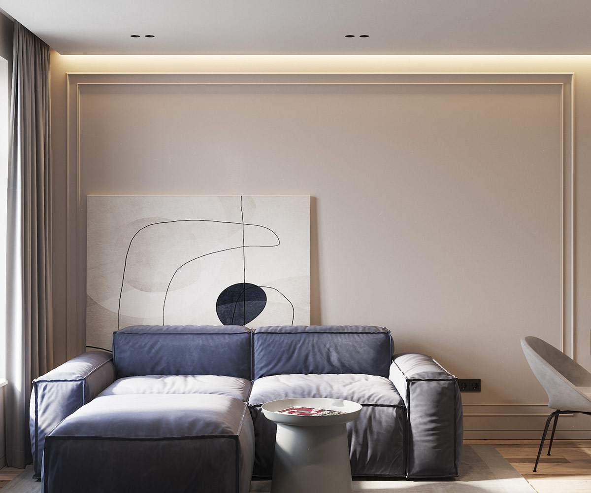 h&igrave;nh ảnh ph&ograve;ng kh&aacute;ch căn hộ 60m2 với ghế sofa m&agrave;u t&iacute;m nhạt, tranh nghệ thuật lớn dựa v&agrave;o tường, b&agrave;n tr&agrave; mặt tr&ograve;n, ch&acirc;n khối trụ