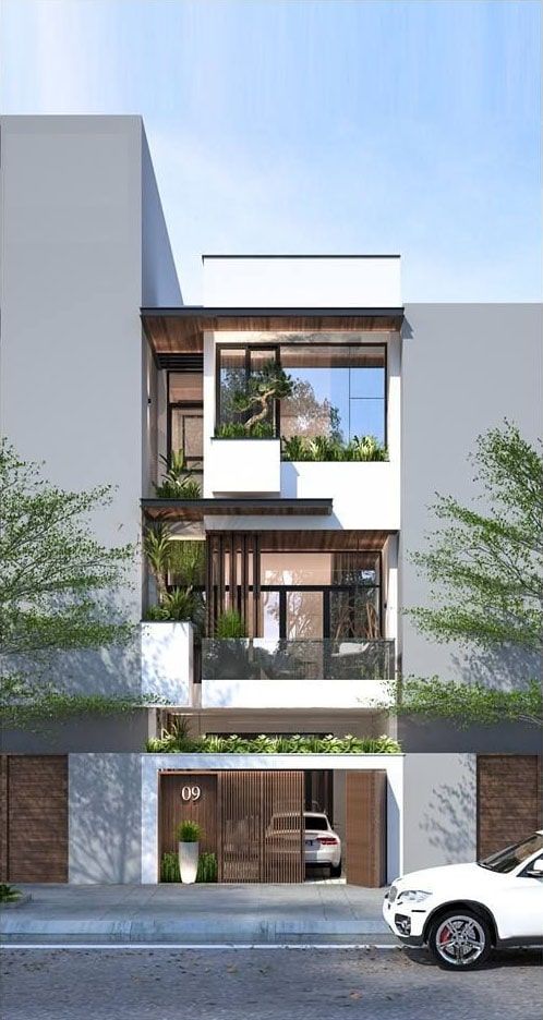 h&igrave;nh ảnh mặt tiền mẫu nh&agrave; 3 tầng với chất liệu gỗ chủ đạo, ngập tr&agrave;n c&aacute;c loại c&acirc;y cảnh