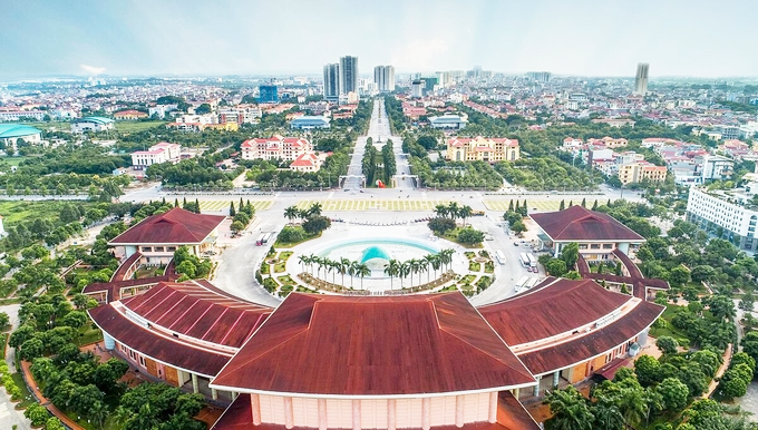 hình ảnh trung tâm TP. Bắc Ninh nhìn từ trên cao với những tòa nhà cao tầng, khu dân cư thấp tầng xen kẽ cây xanh, đường sá
