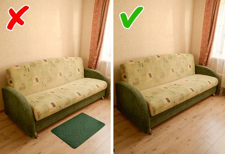 hình ảnh cận cảnh ghế sofa dài, phía trước đặt thảm nhỏ màu xanh lá