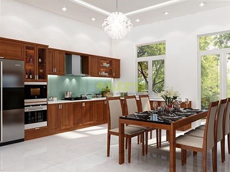 Ph&ograve;ng bếp kết hợp ph&ograve;ng ăn, c&oacute; cửa mở ra s&acirc;n sau tho&aacute;ng đ&atilde;ng. Nội thất gỗ m&agrave;u trầm gi&uacute;p gia tăng vẻ ấm c&uacute;ng, gần gũi.
