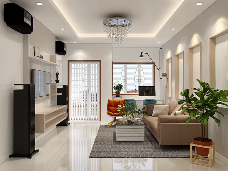 Trong phòng khách, thảm trải sàn giúp "cố định" khu vực dành cho ghế sofa, bàn trà, ghế ngồi thư giãn, đọc sách. Chậu cảnh xanh mát tạo điểm nhấn sinh động.