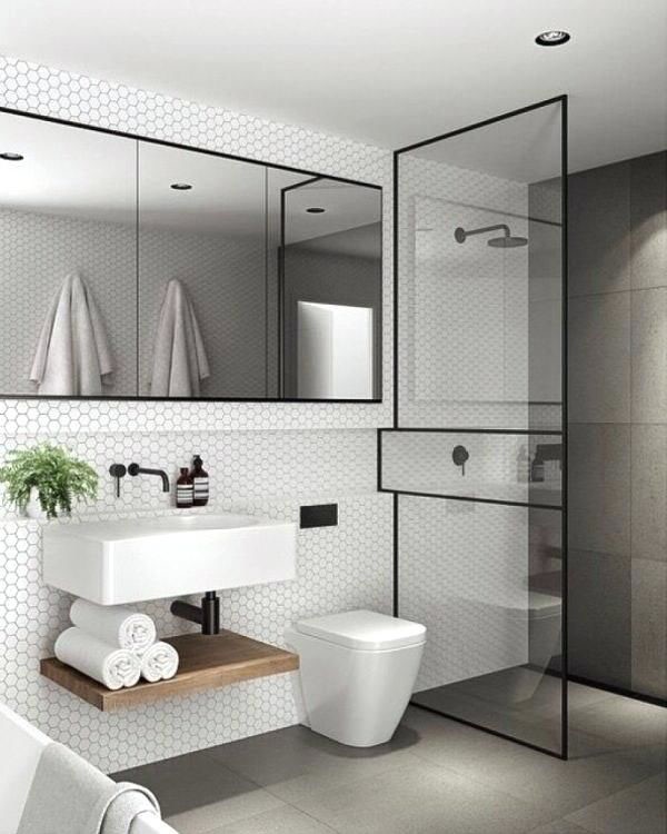 Trong nh&agrave; ống 3 tầng, ph&ograve;ng vệ sinh c&oacute; thiết kế đơn giản, hiện đại, sử dụng t&ocirc;ng m&agrave;u đen trắng h&agrave;i h&ograve;a, sang trọng.