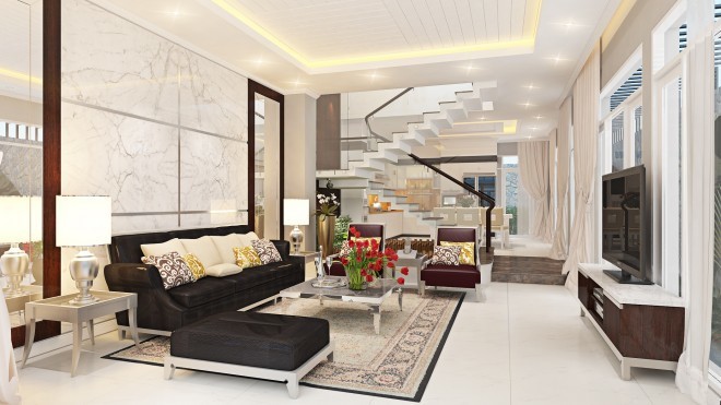 Phòng khách nhà ống 3 tầng nổi bật với bộ ghế sofa da màu đen sang trọng và bức tường ốp đá cẩm thạch tinh tề, hài hòa với phông nền chung của căn phòng.