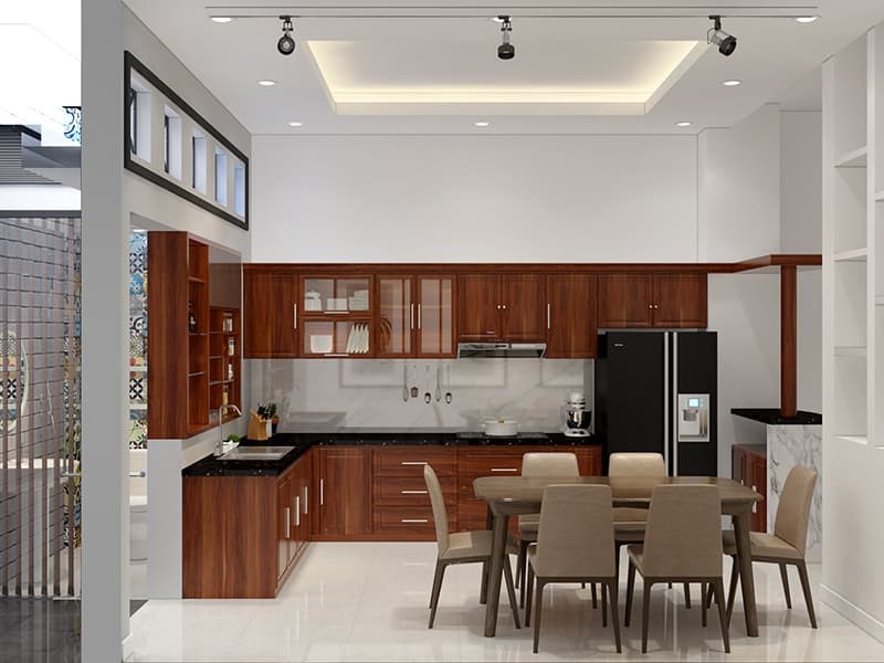 Ph&ograve;ng bếp ấm c&uacute;ng, tạo cảm gi&aacute;c gần gũi v&agrave; th&acirc;n thiện nhờ sự hiện diện của nội thất gỗ tự nhi&ecirc;n t&ocirc;ng m&agrave;u n&acirc;u c&aacute;nh gi&aacute;n. Căn ph&ograve;ng c&oacute; cửa mở ra ngo&agrave;i tho&aacute;ng đ&atilde;ng.
