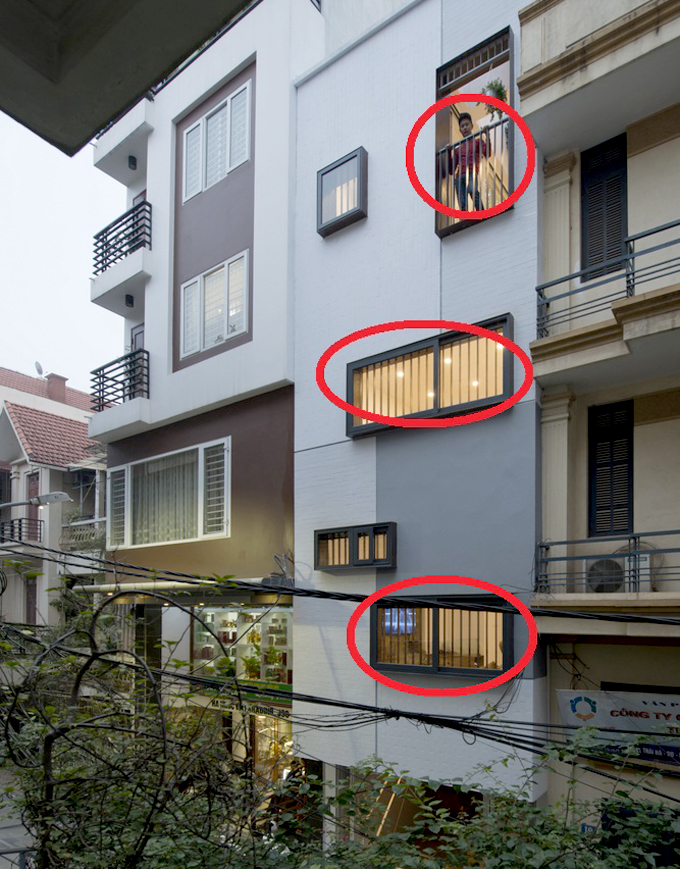 hình ảnh mặt bên nhà ống với các ô khoanh tròn màu đỏ thể hiện lối thoát hiểm