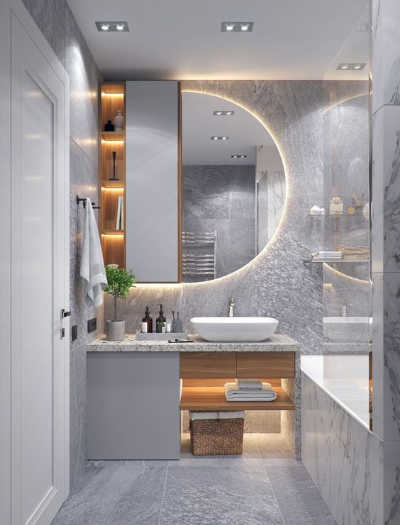 Ph&ograve;ng vệ sinh trong nh&agrave; ống 4 tầng được thiết kế với bảng m&agrave;u x&aacute;m trắng sang trọng, tạo cảm gi&aacute;c sạch sẽ v&agrave; tho&aacute;ng rộng hơn.
