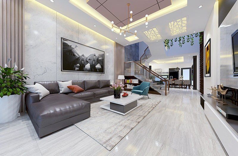 Kh&ocirc;ng gian ph&ograve;ng kh&aacute;ch sang trọng với t&ocirc;ng m&agrave;u trung t&iacute;nh chủ đạo, l&agrave;m nền cho bộ ghế sofa da m&agrave;u đen v&agrave; tranh treo tường th&ecirc;m phần nổi bật.