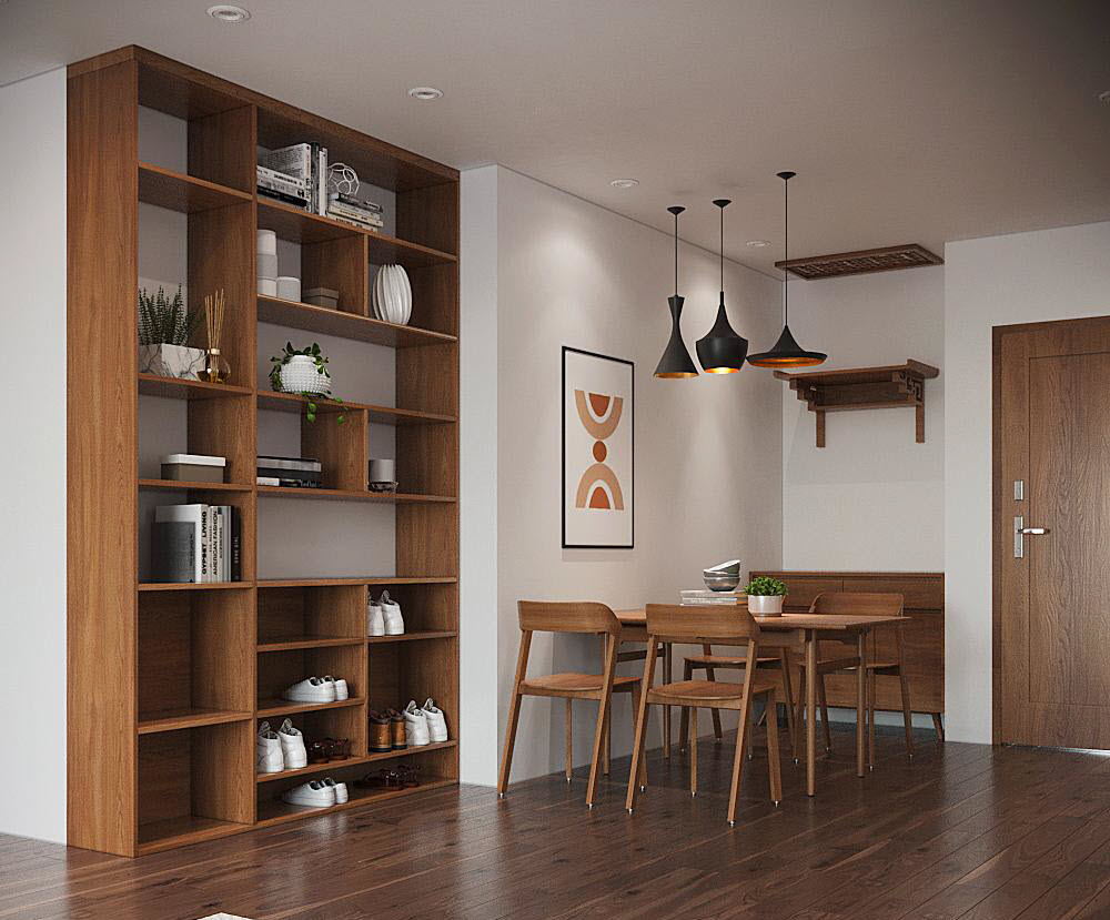 Phòng ăn liền kề có thiết kế tối giản, sử dụng nội thất gỗ tông màu ấm áp, thân thiện. Bộ đèn thả với phần chụp màu đen sang trọng tạo điểm nhấn hút mắt.