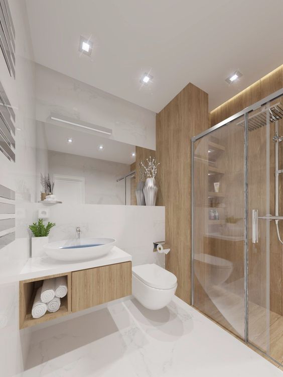 Trong nhà ống 5 tầng kết hợp kinh doanh, khu vực vệ sinh và buồng tắm vòi sen được phân tách rõ bởi vách kính cường lực chắc chắn.