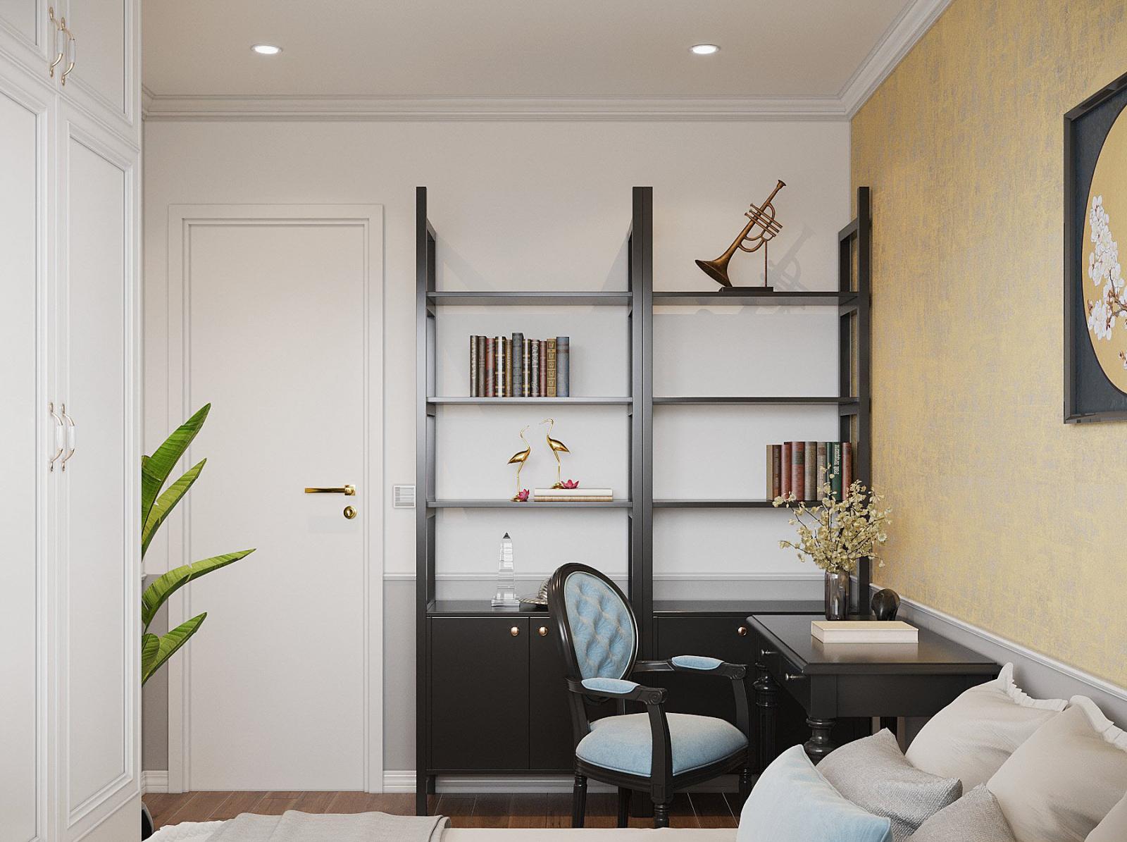 Kệ s&aacute;ch được bố tr&iacute; gọn g&agrave;ng, tận dụng diện t&iacute;ch ngay cạnh cửa v&agrave;o ph&ograve;ng.