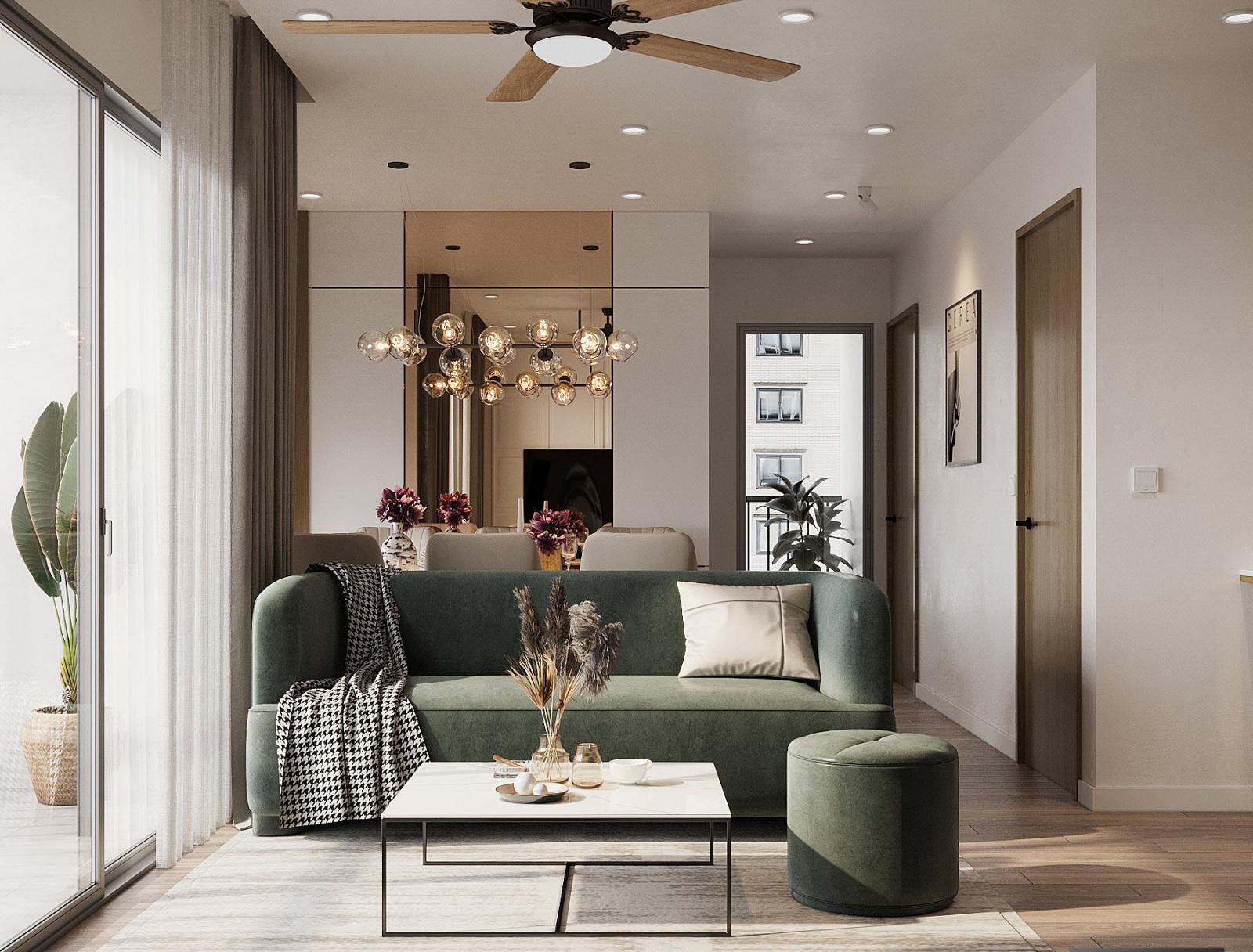 ph&ograve;ng kh&aacute;ch căn hộ 75m2 nổi bật với ghế sofa m&agrave;u xanh l&aacute; nhẹ nh&agrave;ng.