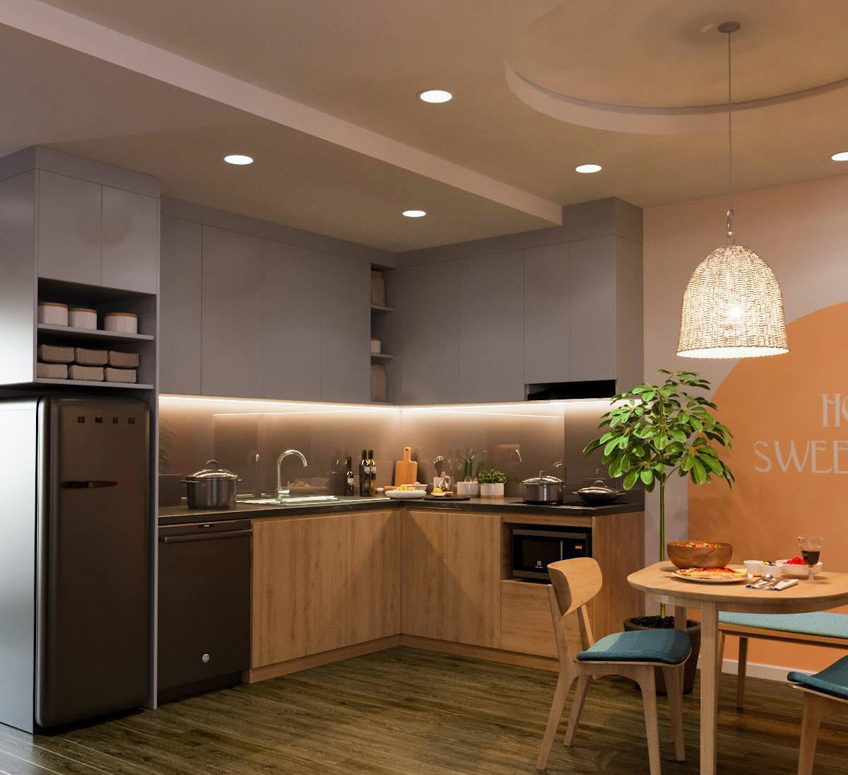 Thiết kế bếp chữ L hài hòa, gọn xinh và giúp tận dụng tối đa diện tích sàn. Ánh sáng đèn thả nơi bàn ăn, đèn LED tủ bếp tạo bầu không khí ấm cúng, gần gũi.