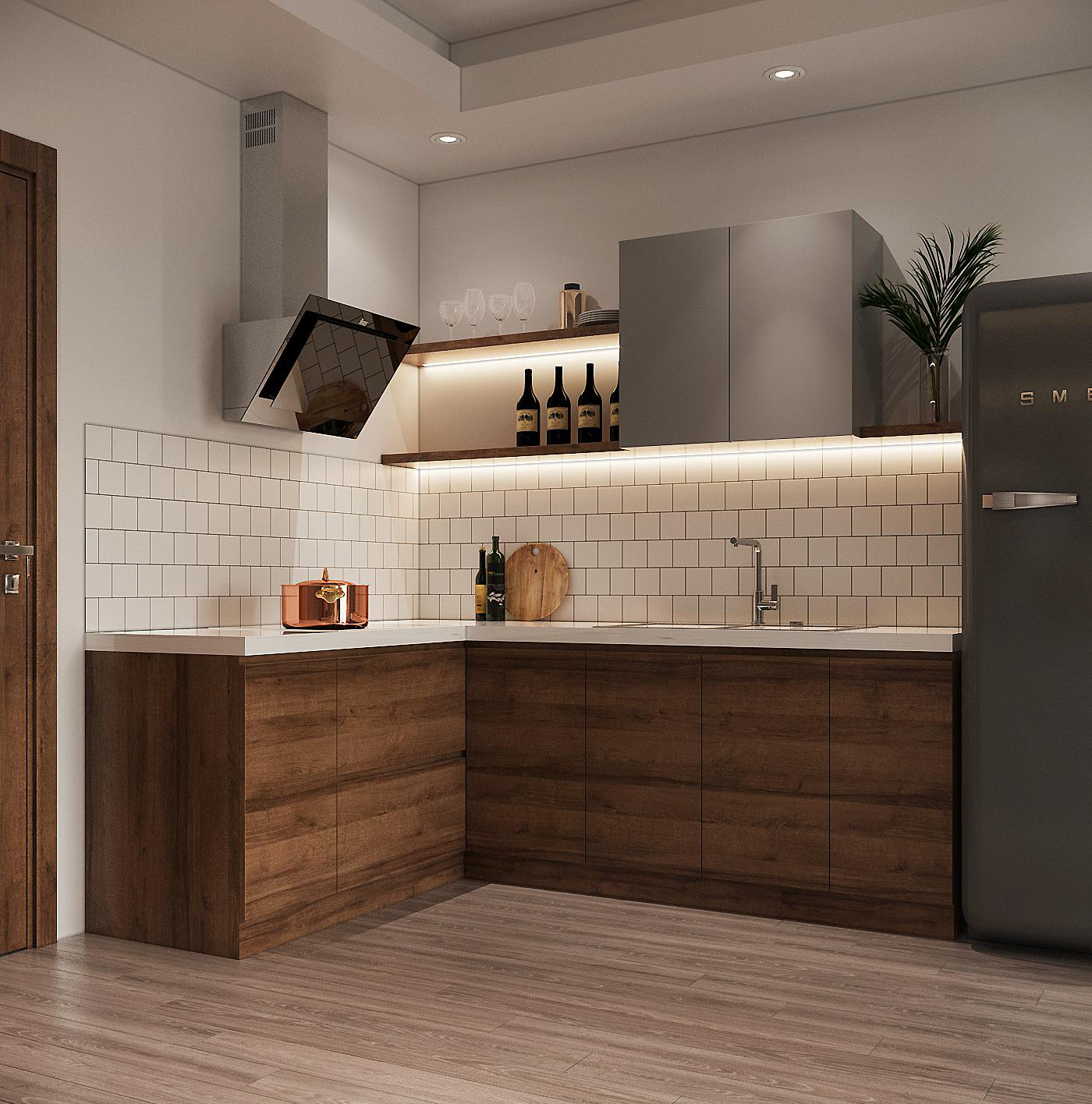 Gian bếp chữ L nhỏ gọn gi&uacute;p tối ưu h&oacute;a diện t&iacute;ch sử dụng, ph&ugrave; hợp với người trẻ độc th&acirc;n. Tường chắn bếp cực bắt mắt với gạch thẻ m&agrave;u trắng kết hợp c&ugrave;ng &aacute;nh s&aacute;ng đ&egrave;n.