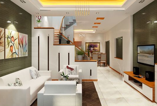Tại phòng khách, tủ trang trí kiêm chức năng vách ngăn tinh tế, giúp giấu gọn khu vực cầu thang và khu bếp phía sau nhà.