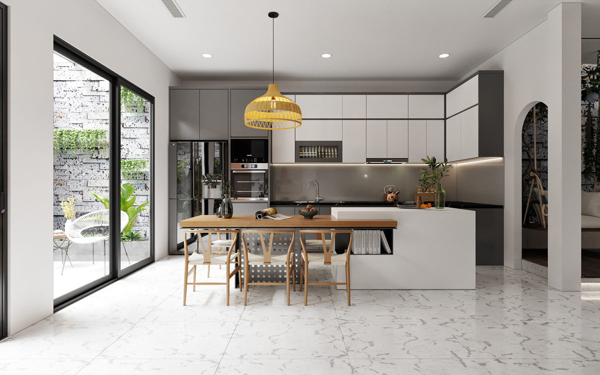 B&agrave;n ăn được t&iacute;ch hợp v&agrave;o mặt b&ecirc;n của đảo bếp tạo th&agrave;nh một mảng tinh gọn. Đ&egrave;n mặt d&acirc;y chuyền chiếu s&aacute;ng khu vực ăn uống. 