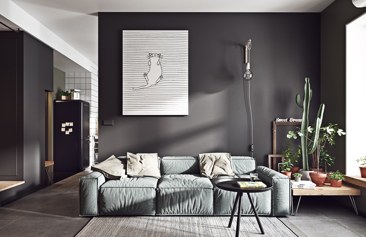 Thiết kế nội thất ph&ograve;ng kh&aacute;ch phong c&aacute;ch Scandinavian tối giản với bức tường m&agrave;u đen tuyền t&aacute;o bạo v&agrave; c&aacute; t&iacute;nh. Loạt chậu xương rồng tr&ecirc;n kệ gỗ cạnh sofa tựa như một khu vườn "mini" m&aacute;t mắt.