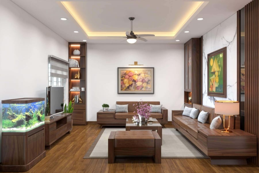Phòng khách có thiết kế đơn giản với bảng màu nâu cà phê ấm áp, thân thiện. Những điểm nhấn từ tranh tường, bể cá cảnh khiến căn phòng trở nên sinh động, cuốn hút hơn.