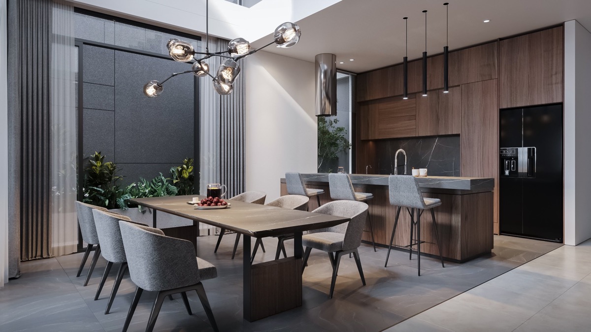 Bộ ghế ăn v&agrave; ghế bar bọc nệm m&agrave;u x&aacute;m, trong khi tủ bếp mang đến t&ocirc;ng m&agrave;u gỗ ấm &aacute;p cho tổng thể kh&ocirc;ng gian ph&ograve;ng.