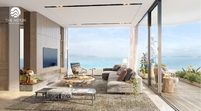 A living room with a view of the oceanDescription automatically generated with low confidence