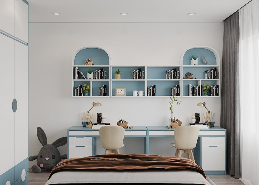 Góc học tập gọn gàng, tiện nghi dành cho hai bé. Đường nét nội thất cong vòm uyển chuyển làm "mềm" không gian phòng ngủ.