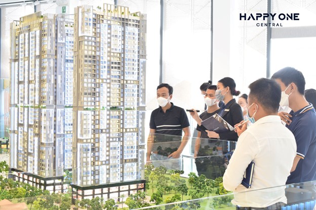 A group of people standing outside a buildingDescription automatically generated with low confidence
