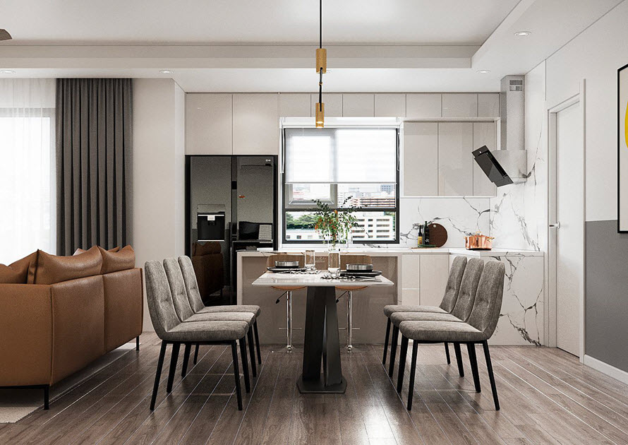 Liên thông với phòng khách là không gian phòng ăn, khu bếp thoáng sáng. Ghế sofa đóng vai trò như vách ngăn tương đối giữa hai khu vực khách - bếp.