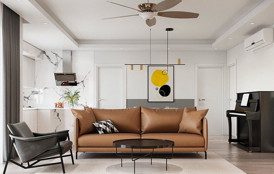 Phòng khách căn hộ với sofa nâu da bò, bàn trà tròn màu đen