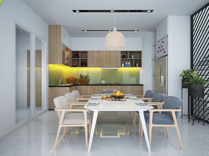 Bếp v&agrave; ph&ograve;ng ăn kết hợp được thiết kế theo phong c&aacute;ch hiện đại đơn giản cực bắt mắt. Tường chắn m&agrave;u xanh l&aacute; tạo điểm nhấn tr&agrave;n đầy năng lượng.