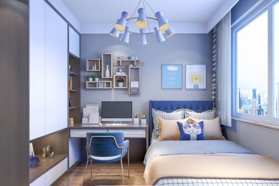 Kh&ocirc;ng gian ngủ nghỉ, học tập của cậu con trai g&acirc;y thiện cảm với t&ocirc;ng m&agrave;u xanh dương nhẹ nh&agrave;ng, tươi m&aacute;t. Diện t&iacute;ch ph&ograve;ng được sử dụng một c&aacute;ch tối ưu.